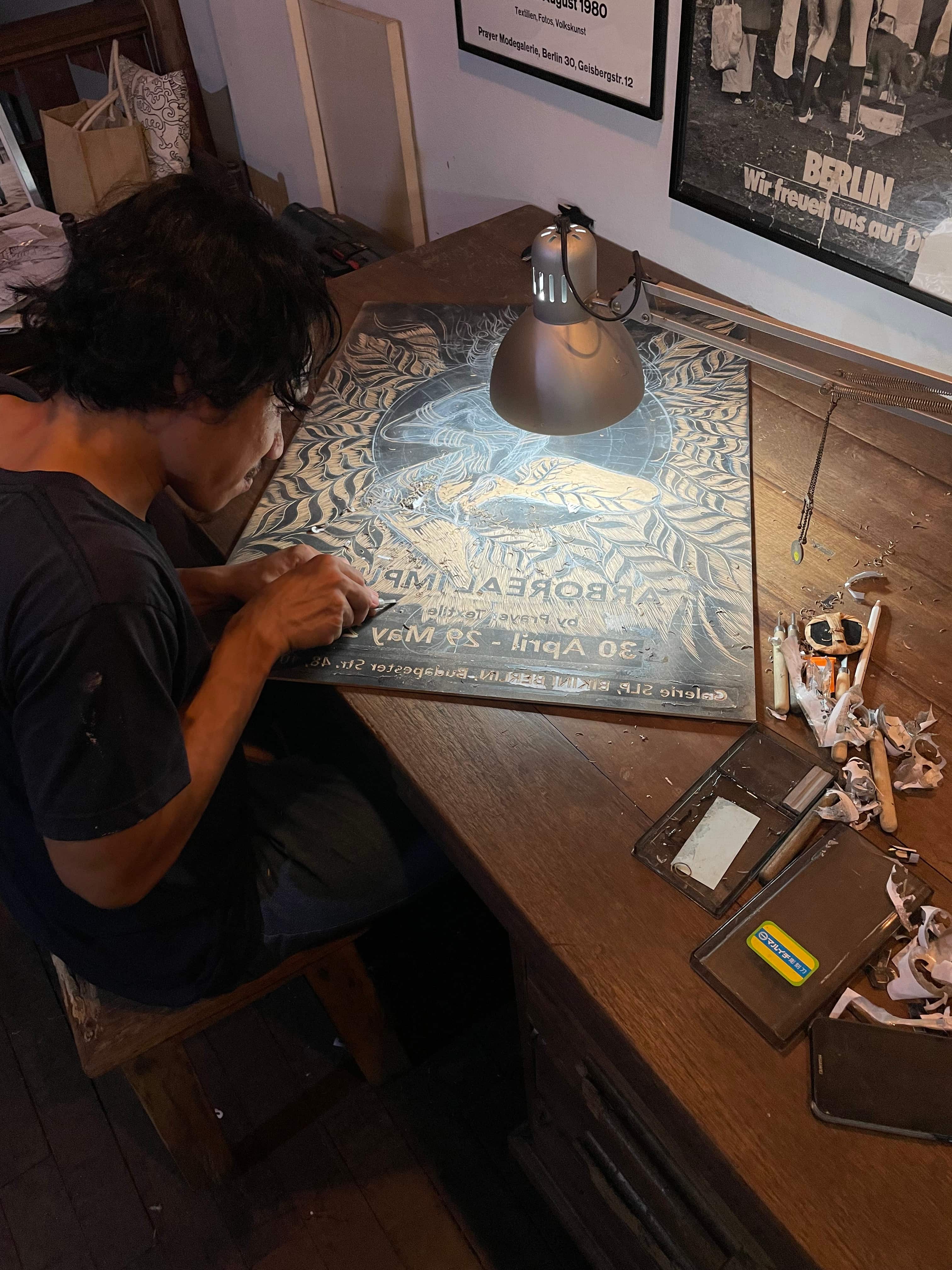Ding carving a printing block